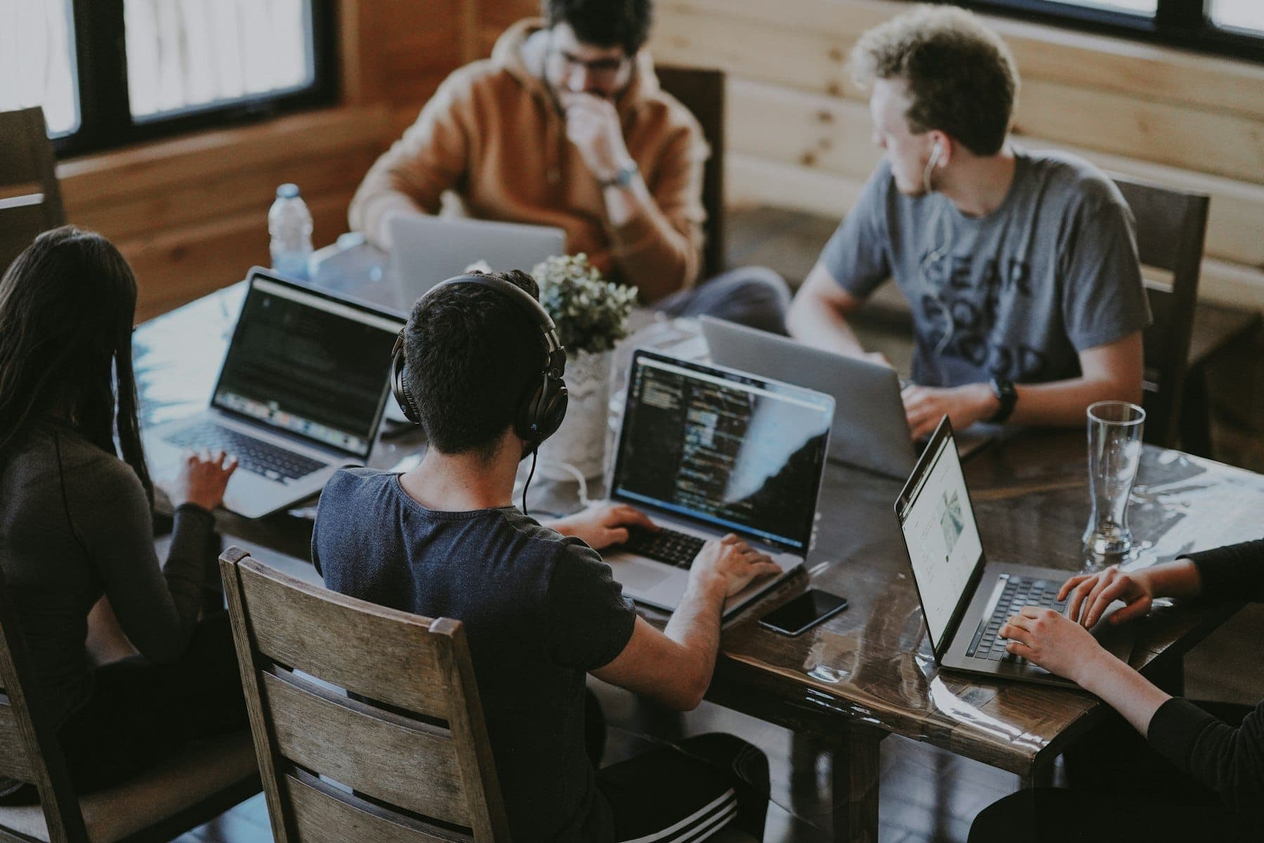 Colleagues working together around a laptop